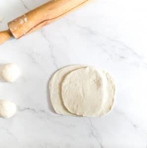 Rolled out pita dough