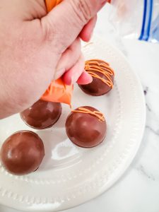 Piped choc over balls