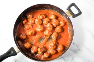 Top Meatballs with sauce